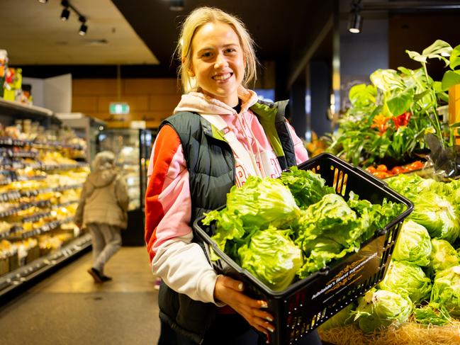 Frewville Foodland regular customer Ella Waltham, 18, from Kensington Gardens with lettuce in the supermarket in Frewville, Kaurna Yarta/ Adelaide on Sunday, August 21, 2022. (The Advertiser/ Morgan Sette)