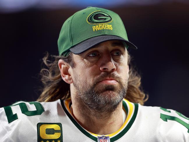 DETROIT, MICHIGAN - JANUARY 09: Aaron Rodgers #12 of the Green Bay Packers runs to the locker room at halftime during a game against the Detroit Lions at Ford Field on January 09, 2022 in Detroit, Michigan. (Photo by Rey Del Rio/Getty Images)