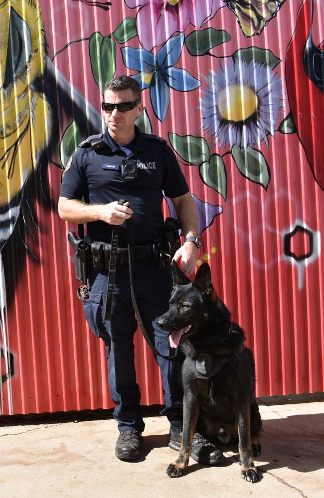 Police Dog Wedge and handler Senior Constable First Class Matthew Unwin helped to find an 18-year-old woman who had gone missing in bushland near the CBD last year. Picture: NT Police