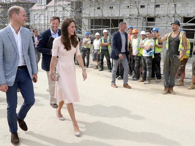 NEWQUAY, ENGLAND - SEPTEMBER 01: Prince William, Duke of Cambridge and Catherine, Duchess of Cambridge share a joke with construction workers as they visit Nansledan, a 218-hectare site that will provide future business and housing for the local area on September 1, 2016 in Newquay, United Kingdom. (Photo by Chris Jackson - WPA Pool/Getty Images)