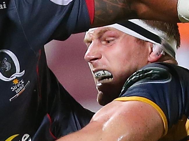 BRISBANE, AUSTRALIA - FEBRUARY 12: Samu Kerevi of the Reds is tackled by David Pocock of the Brumbies during the Super Rugby Pre-Season match between the Reds and the Brumbies at Ballymore Stadium on February 12, 2016 in Brisbane, Australia. (Photo by Chris Hyde/Getty Images)