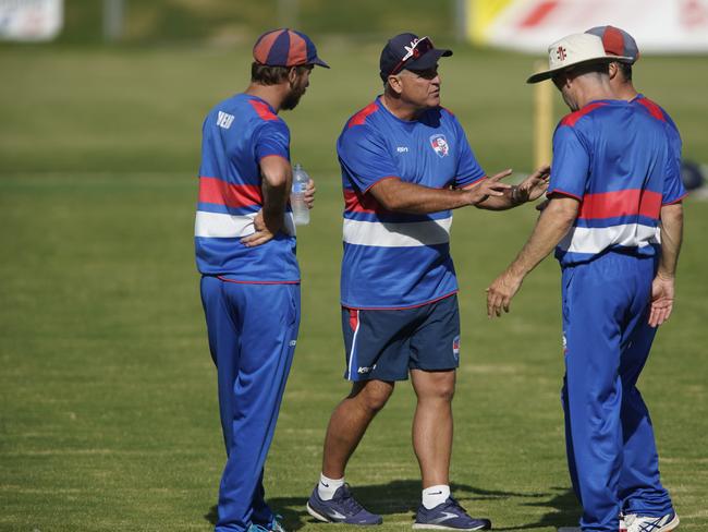 Mornington coach Darren Berry talks to his players at the drinks break. Picture: Valeriu Campan