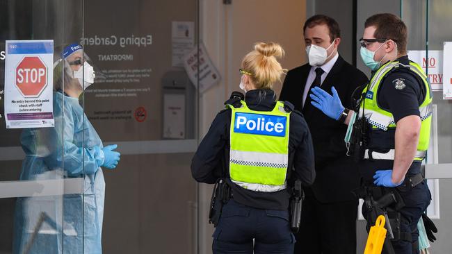 Police speak to staff at the Epping Gardens aged care facility. Picture: William West/AFP.