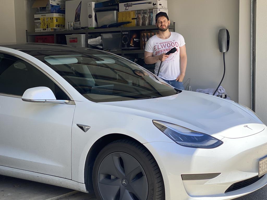 Oscar Williams has been able to save money on the costs to charge his Tesla by switching to green energy. Picture: Supplied.