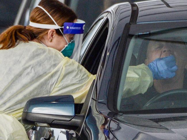 ADELAIDE, AUSTRALIA - NewsWire Photos JULY 01, 2021 -  Lines of cars and health workers at the Victoria Park Covid testing clinic in Adelaide. Picture: NCA NewsWire / Brenton Edwards