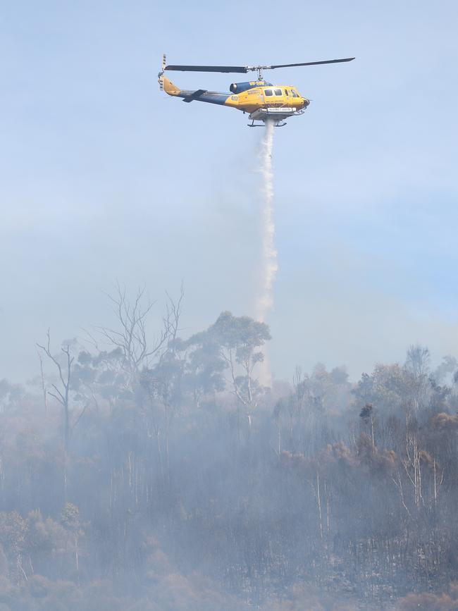 Helicopter dumping water. Bushfire in Dynnyrne threatening homes. Picture: Nikki Davis-Jones