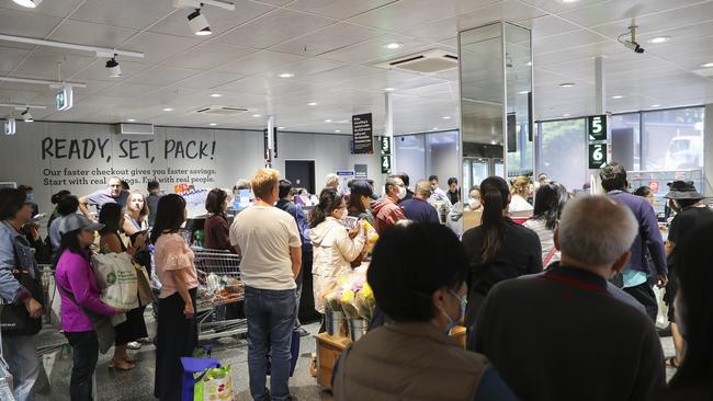 Hundreds of people line up for this mornings opening of Aldi in North Strathfield in Sydney. Picture: Dylan Robinson