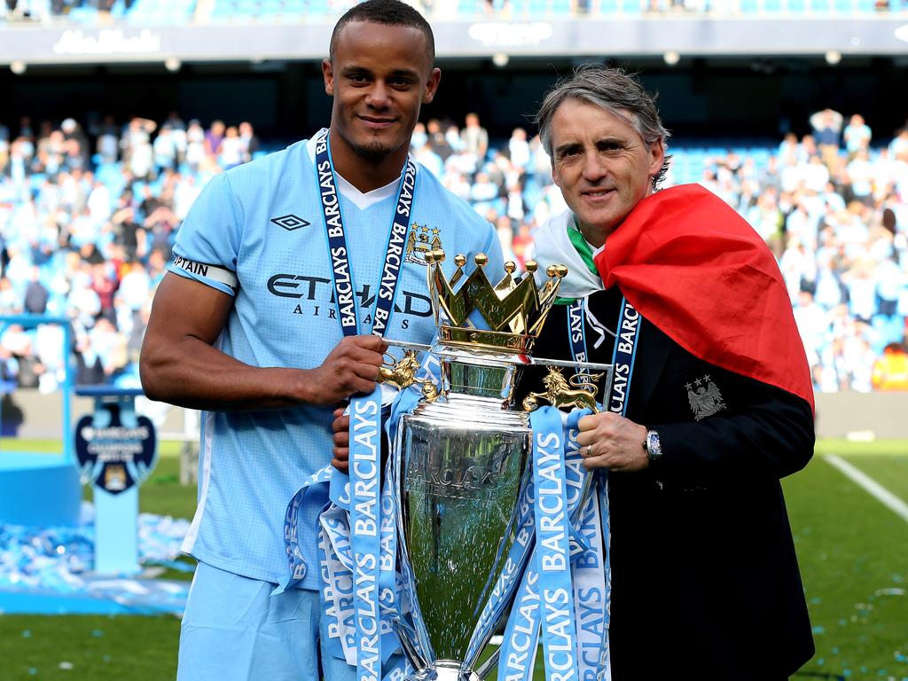 Man City captain Vincent Kompany with manager Roberto Mancini, who approached the game “coldly”. Picture: Alex Livesey/Getty Images