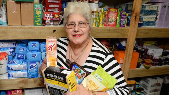 Gina Poulos hands out food parcels to the disadvantaged. Picture: Josie Hayden