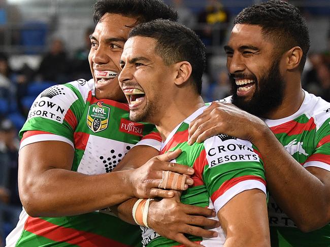 Cody Walker of the Rabbitohs (centre) reacts after scoring a try during the Round 14 NRL match between the Gold Coast Titans and the South Sydney Rabbitohs at CBUS Super Stadium at Robina on the Gold Coast, Friday, June 8, 2018. (AAP Image/Dave Hunt) NO ARCHIVING, EDITORIAL USE ONLY