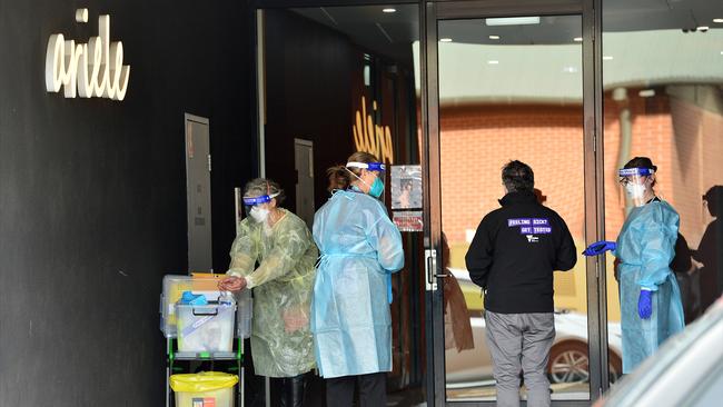 Health workers attend the locked-down Ariele Apartments in Maribyrnong. Picture: NCA NewsWire/Nicki Connolly