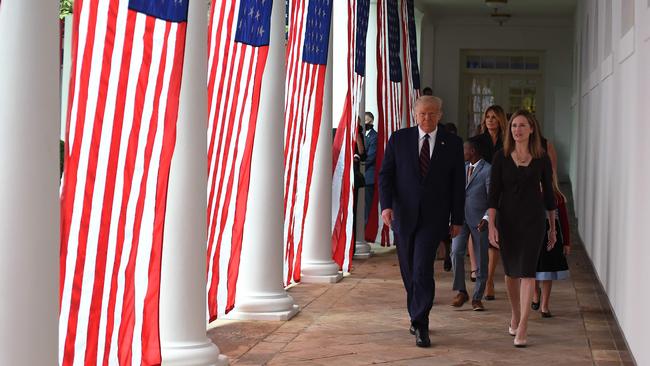 US President Donald Trump and Judge Amy Coney Barrett walk to the Rose Garden of the White House in Washington, DC, on September 26. Picture: AFP