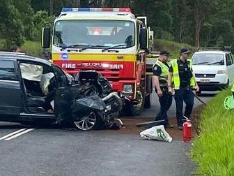 Car crashes down embankment, trapping two on rural road