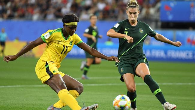 Australia's defender Stephanie Catley (R) vies for the ball with Jamaica's forward Khadija Shaw.