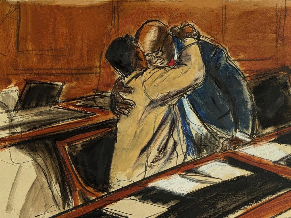 A courtroom sketch shows Sean Combs (left) hugging his attorney Anthony Ricco upon entering the hearing in Federal court in New York on 10 October. Picture: Elizabeth Williams / AP