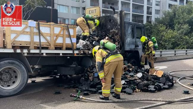 Screengrabs from video. MAJOR TRAFFIC IMPACTS AS TRUCK CATCHES FIRE ON ANZAC BRIDGE, PYRMONT. 11 MarCH 2024 12:32pm Photo: NSW Fire and Rescue