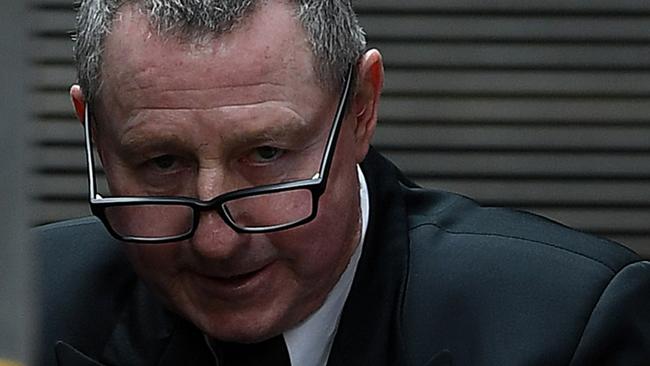 Terry Hickson is escorted to a prison van at the Supreme Court in Sydney, Monday, November 18, 2019. (AAP Image/Joel Carrett) NO ARCHIVING