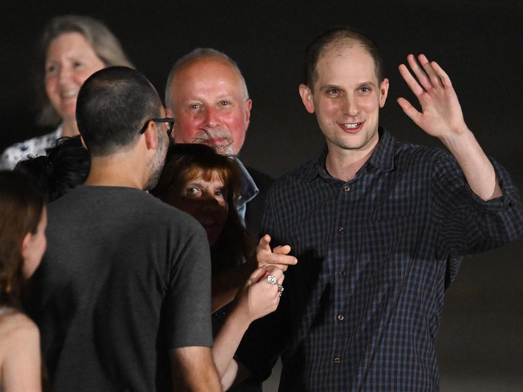 Former prisoner held by Russia US journalist Evan Gershkovich waves as he arrives at Joint Base Andrews in Maryland. Picture: AFP