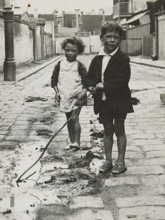 Entrance to a slum pocket in Carlton, about 1930. Picture: F. Oswald Barnett collection, State Library of Victoria