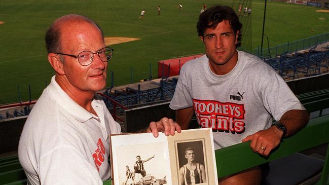 Feb96- John Beveridge former footballer pictured with his son Luke holds a some old photos of his father Jack who played for Collingwood in the 30's. Luke will play for St.Kilda like his father./afl/aussie rules football