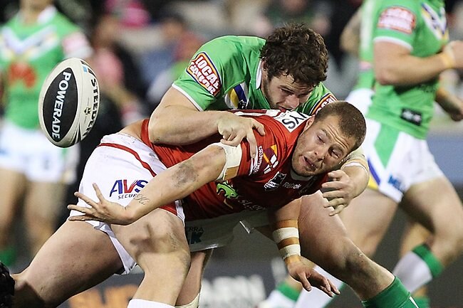 NRL Round 17. Canberra Raiders v St George Illawarra at Canberra Stadium. Trent Merrin of the Dragons passes the ball.