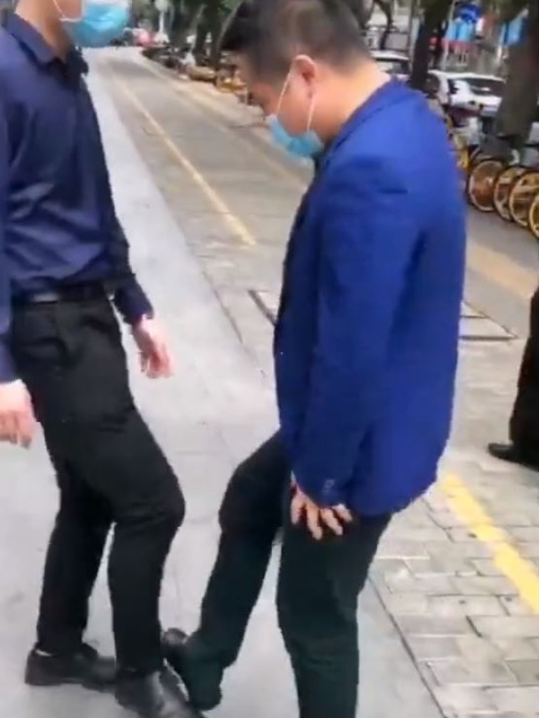 One trending video shows a group of men adopting the ‘foot-touching curtsy’. Picture: Douyin