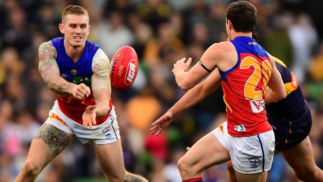 Dayne Beams fires off a handball against West Coast in Round 19.