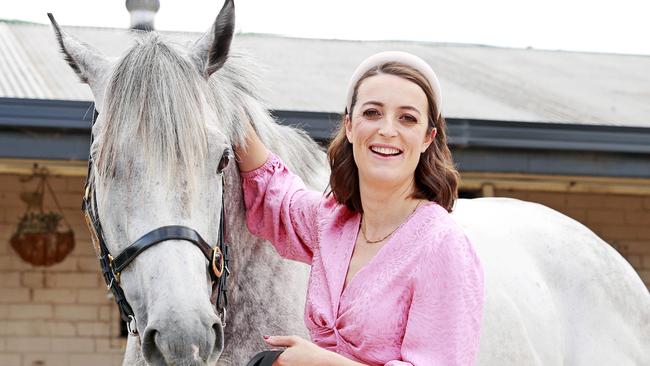 WEEKEND TELEGRAPHS SPECIAL. SEPTEMBER 20, 2022. PLEASE CONTACT WEEKEND PIC EDITOR JEFF DARMANIN BEFORE PUBLISHING.Pictured at her stables in Warwick Farm today is Group 1 winning horse trainer Annabel Neasham, with Race Horse Top Ranked. Picture: Tim Hunter.