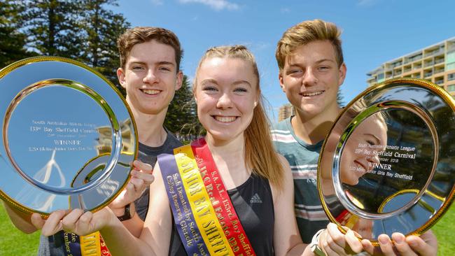 Coastal Districts Athletics Club members Aidan Konopka, Katie Woodmore and Max Disbury at Colley Reserve. Picture: AAP/Brenton Edwards