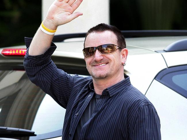 U2 rock band members at Palazzo Versace hotel, Gold Coast, Queensland - Singer Bono waving 01 Nov 2006. australia