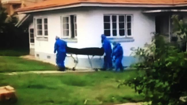 Police remove the body of Mr Morrison in January, 2018, from the Gold Coast home.