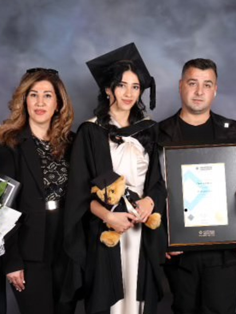 Ms Shakiba with her mother and husband, who is also at risk under the new laws, at her graduation. Picture: Supplied