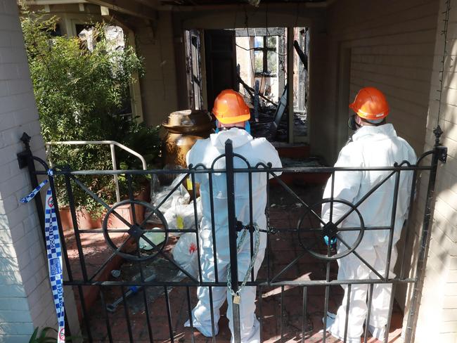 Investigators inspecting the remains on Monday. Picture: John Feder/The Daily Telegraph