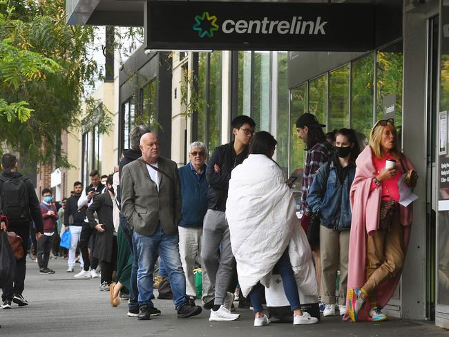 Hundreds of people queue outside Centrelink in Melbourne on March 23. Picture: William West/AFP