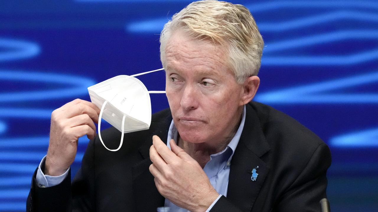 Tiley removes his mask during the draw for the 2022 Australian Open tennis championship at Melbourne Park. Picture: Getty