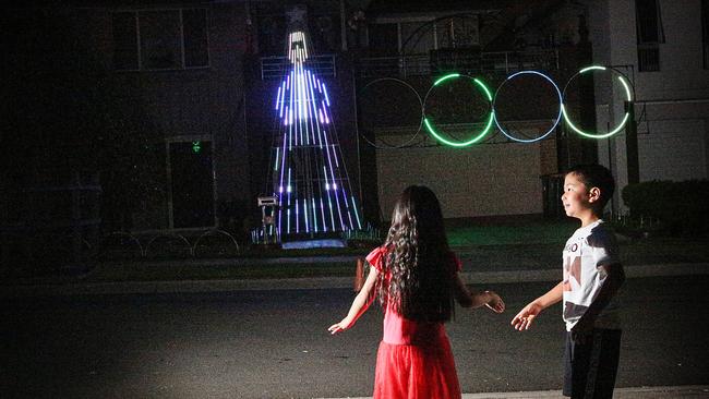 Children dance to the display at 9 Bunnai Rd, Pemulwuy. Picture: Carmela Roche