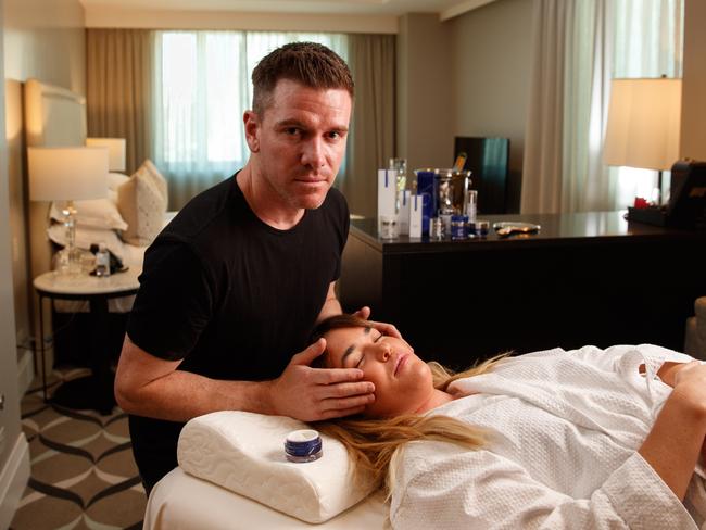 FRESHENING UP: Shaun Douglas-Galley gives Kate Anderson an anti-ageing facial in her room at the Mayfair Hotel. Picture: MATT TURNER