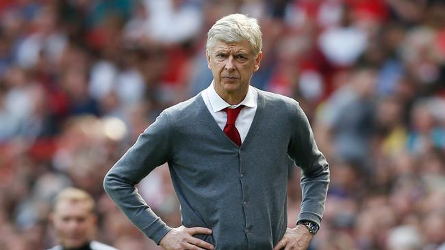 Arsenal's French manager Arsene Wenger watches on from the touch line during the English Premier League football match between Arsenal and West Ham United