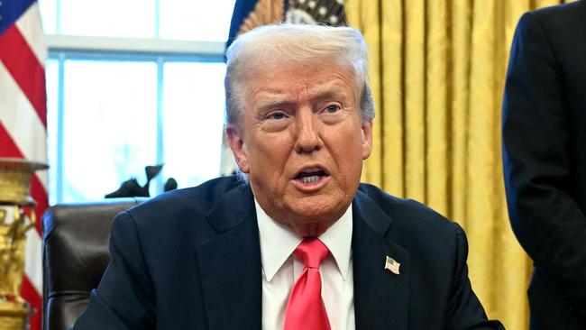 US President Donald Trump speaks to the press before signing an Executive Order, alongside US Secretary of Health and Human Services Robert F. Kennedy Jr. (L) and US Secretary of Commerce nominee Howard Lutnick (R), at the Oval Office of the White House in Washington, DC on February 25, 2025. (Photo by Jim WATSON / AFP)