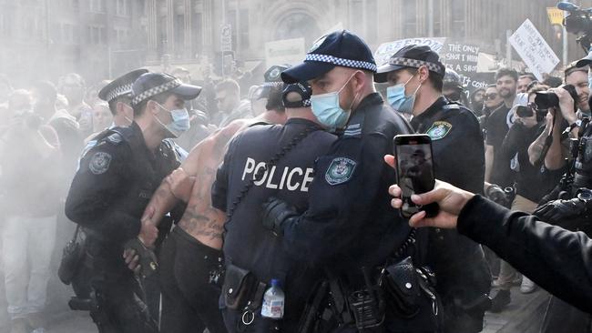 Protesters clash with police in Sydney on July 24.