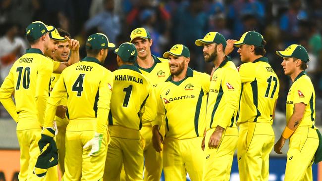 Australia's team captain Aaron Finch (C) celebrates with teammates after the dismissal of Indian cricketer Rohit Sharma