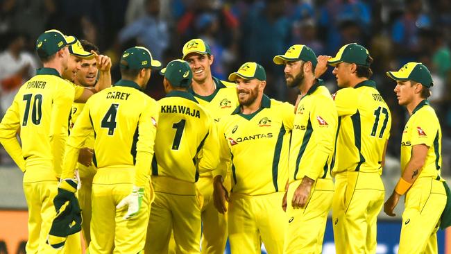 Australia's team captain Aaron Finch (C) celebrates with teammates after the dismissal of Indian cricketer Rohit Sharma 