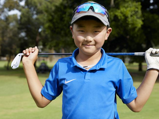 Young golfer in the swing