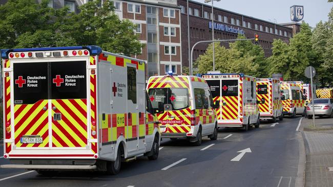Ambulances drive to the Eduardus Hospital in Cologne-Deutz to evacuate the hospital before specialists defuse three unexploded US bombs from World War II. Picture: Henning Kaiser/dpa via AP