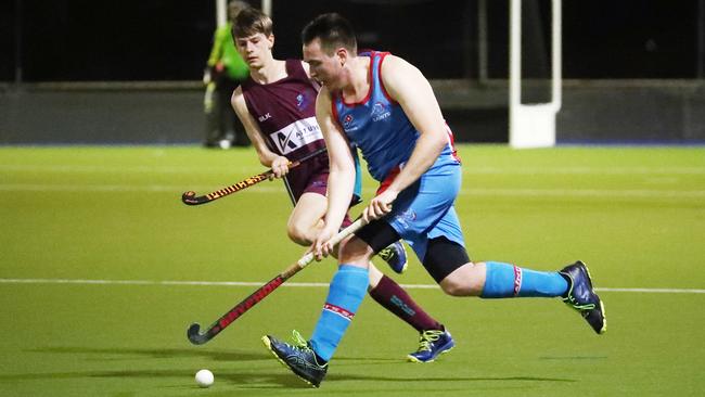 Saints' Daniel Pittendreigh pushes the ball up in the Cairns Hockey A Grade Men's match between Cairns Brothers and Cairns Saints. PICTURE: BRENDAN RADKE