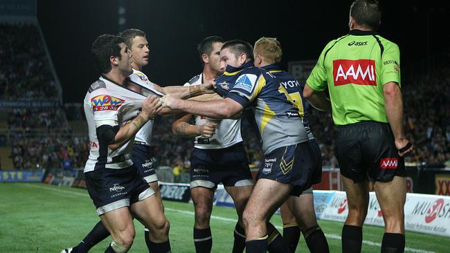 Michael Ennis gets to grips with the Cowboys back in 2008. Picture: Peter Wallis