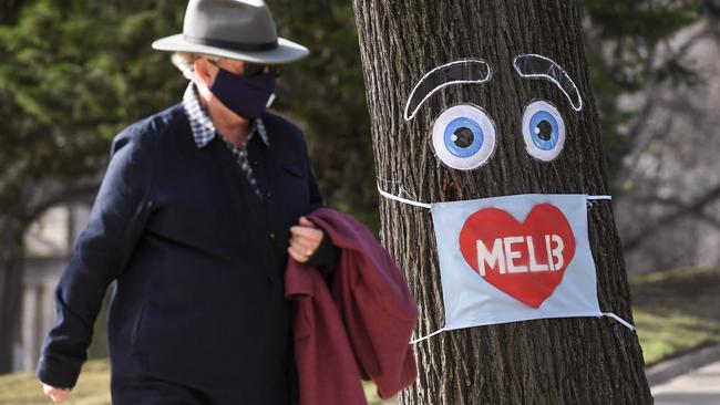 An elderly man walks in Melbourne on Monday. Picture: AFP