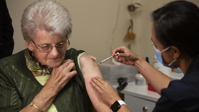 Rembrandt Aged Care resident Tinie Nieuwenhoven 80yrs receives the Pfizer vaccine from nurse Lynn Phan in the age care facility at Oaklands Park, SA. Picture: Emma Brasier