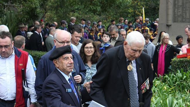 George Katsoolis of St Ives, left, at the Anzac Day morning service at Wahroonga's War Memorial.   Picture: TOM WESTBROOK