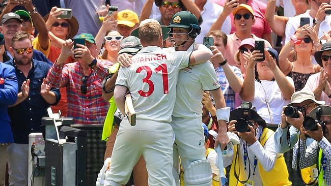 David Warner embraces Steve Smith as he leaves the field one last time. (Photo by Mark Evans/Getty Images)